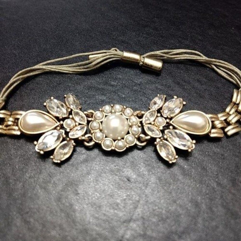 Gold tone faux pearl bracelet adjustable rhinestones
